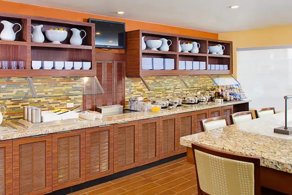 Complimentary hot breakfast buffet with eggs, bacon, fruit at Hyatt House LAX