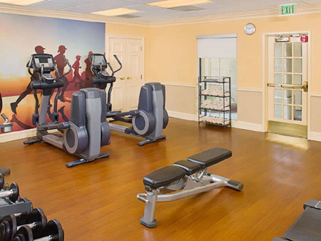 24-hour fitness center with treadmills and weights at Hyatt House LAX